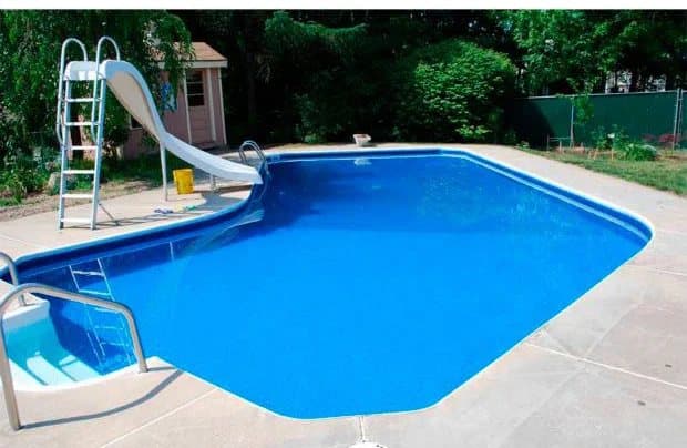 Backyard pool with a new blue vinyl liner